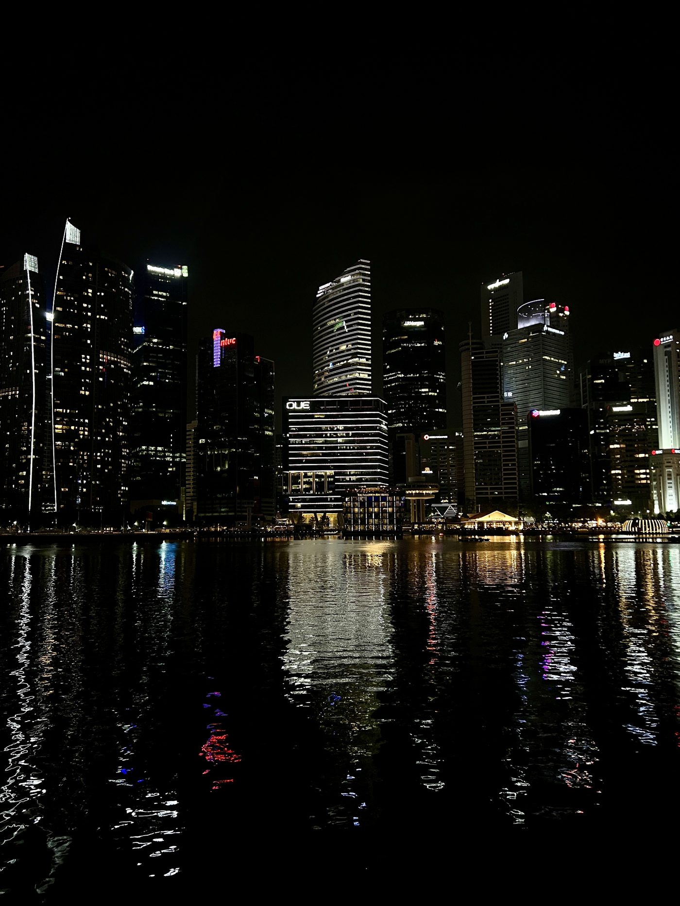 Singapore skyline reflected at night